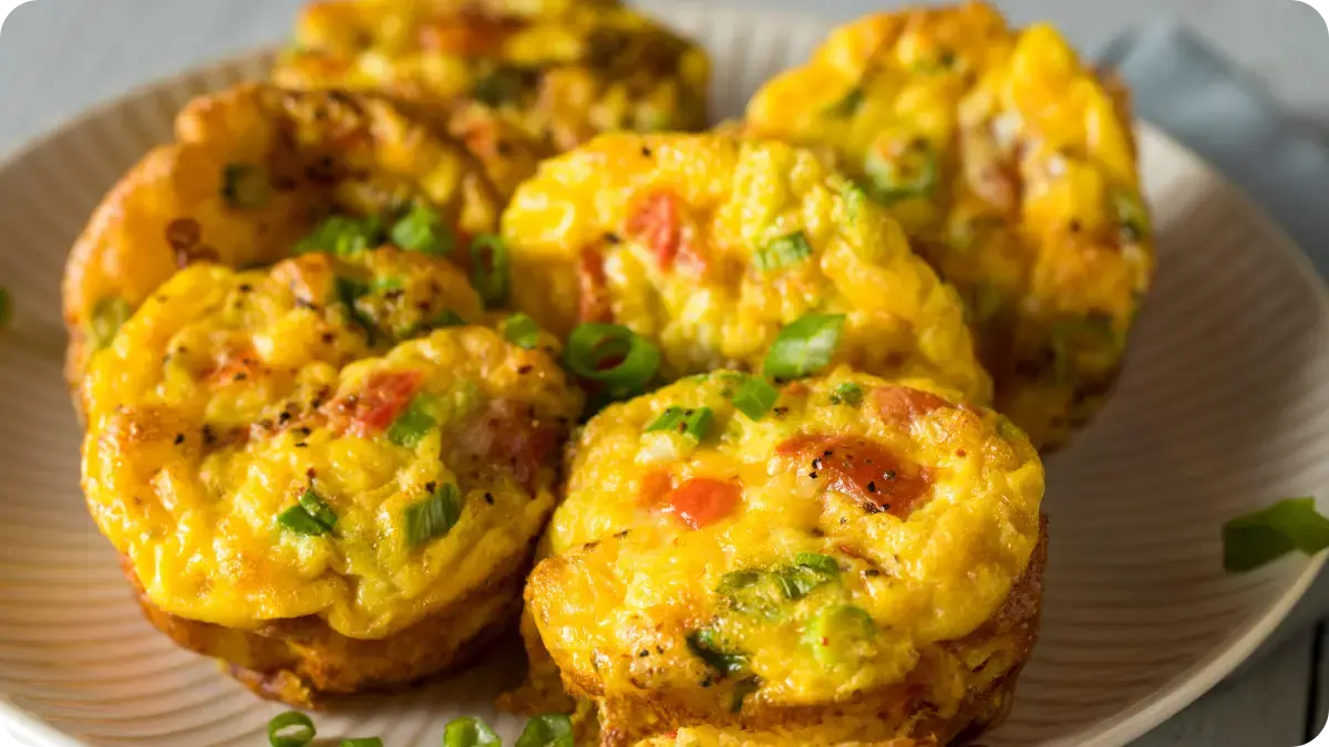 6 mini egg cups on a plate.