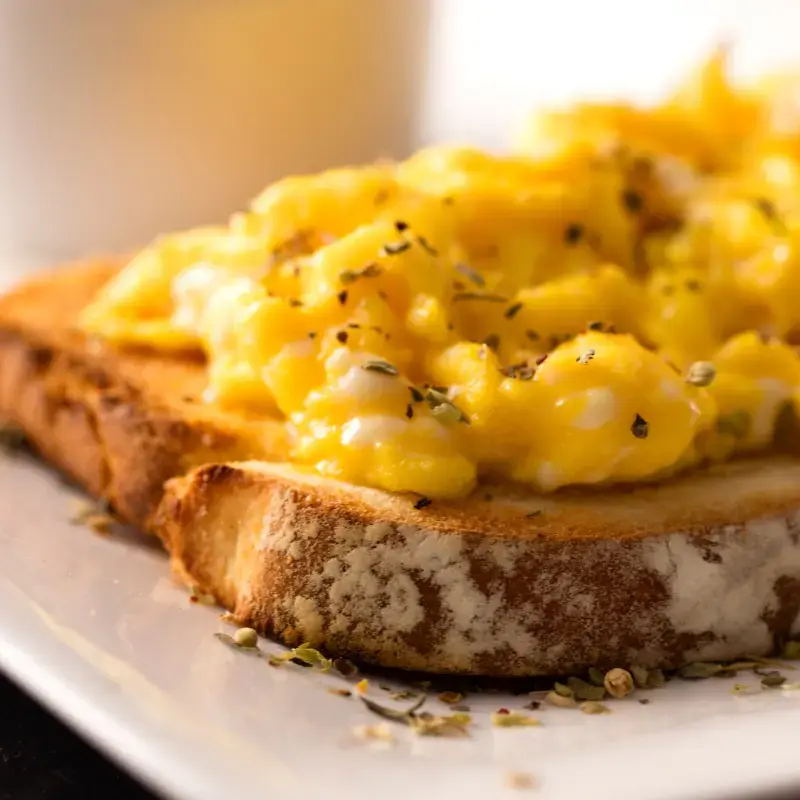 Scrambled egg on toast. Scrambled egg on toast.